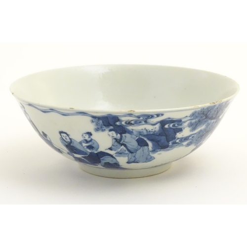 13 - A 19thC Chinese blue and white bowl depicting figures in a landscape. Approx. 2 3/4'' high x 7 1/2''... 