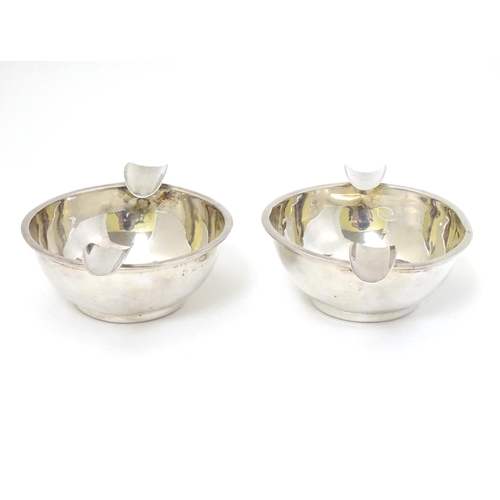 130 - A pair of silver ashtrays hallmarked Birmingham 1939 maker Barker Brothers Silver Ltd. 4'' wide over... 