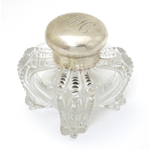 135 - A Victorian glass inkwell with silver top hallmarked London 1897 maker Hukin & Heath. Approx 3 1/2''... 