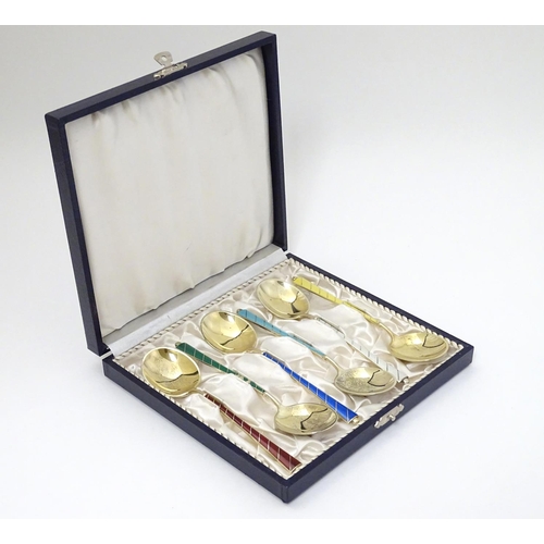 136 - Scandinavian Silver : A cased set of 6 Danish silver gilt spoons with guilloche enamel decoration to... 