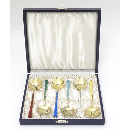 136 - Scandinavian Silver : A cased set of 6 Danish silver gilt spoons with guilloche enamel decoration to... 