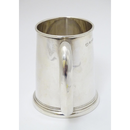 139 - A silver tankard hallmarked Birmingham 1936 maker Alexander Clarke Co. Ltd. 3 3/4'' long (160g)