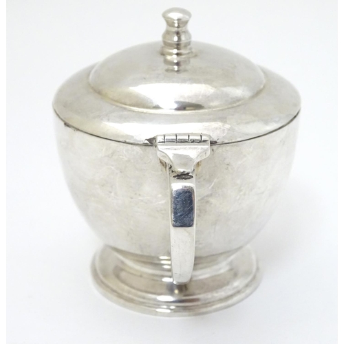 140 - An Art Deco silver mustard pot Hallmarked London 1939 maker Harrods Ltd ( Richard Woodman Burbridge)... 