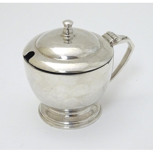 140 - An Art Deco silver mustard pot Hallmarked London 1939 maker Harrods Ltd ( Richard Woodman Burbridge)... 