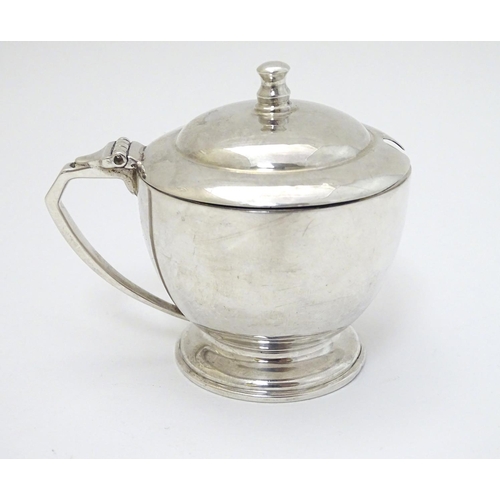 140 - An Art Deco silver mustard pot Hallmarked London 1939 maker Harrods Ltd ( Richard Woodman Burbridge)... 