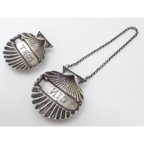 143 - Two silver plate decanter labels / bottle tags of scallop shell form 'Gin' and 'Port. ' 2'' wide