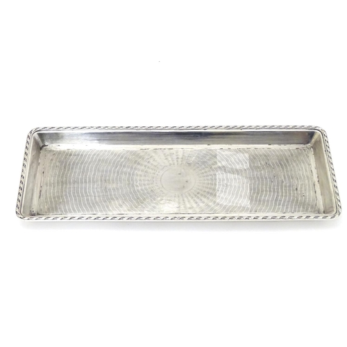 148 - A silver dressing table tray with engine turned decoration hallmarked London 1911 maker Goldsmiths &... 