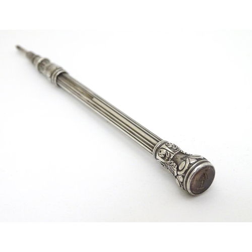 149 - A 19thC  white metal pencil set with engraved rock crystal seal to end. Approx 5'' long