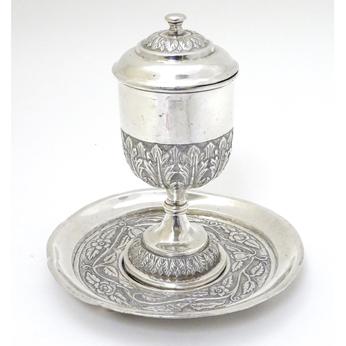 151 - A white metal chalice and cover 5'' high  together with a paten 5 1/4'' diameter (2)