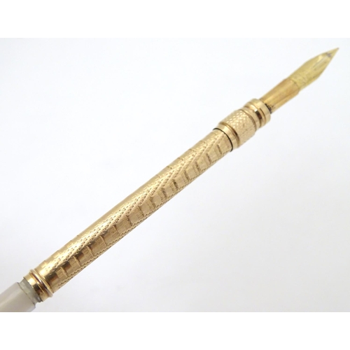 154 - A gilt metal dipping pen with mother of pearl handle. Cased 6 1/2'' long