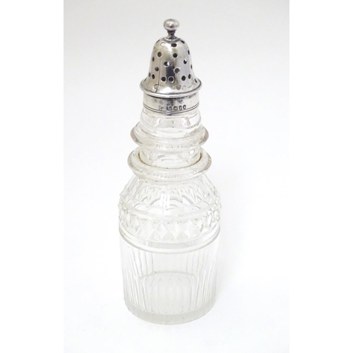 157 - A cut glass pepperette with silver top hallmarked London 1864 maker George John Richards & Edward Ch... 