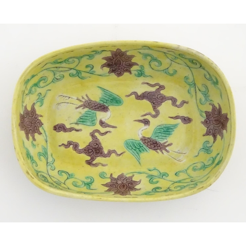 16 - A small Chinese dish decorated with stylised birds, clouds and flowers. Character marks to base. App... 