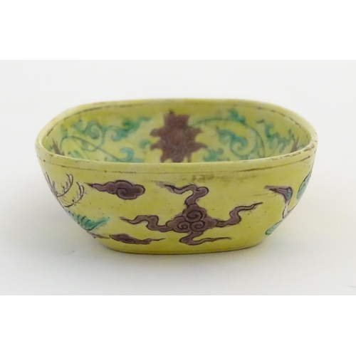 16 - A small Chinese dish decorated with stylised birds, clouds and flowers. Character marks to base. App... 