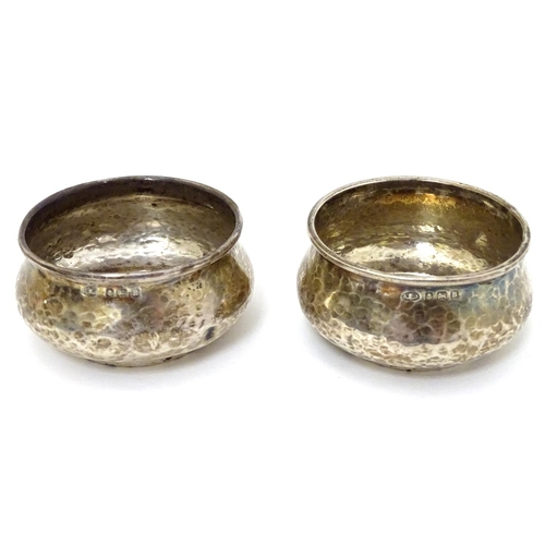 160 - A pair of Art Deco silver salts with hammered decoration hallmarked Birmingham 1923 maker Albert Edw... 