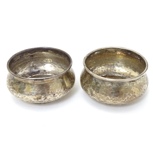 160 - A pair of Art Deco silver salts with hammered decoration hallmarked Birmingham 1923 maker Albert Edw... 