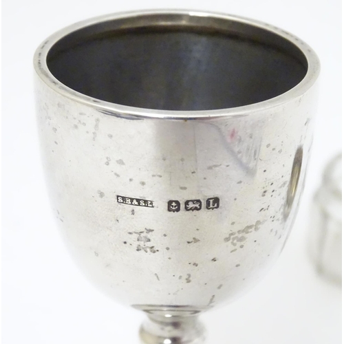 162 - A silver egg cup hallmarked Birmingham 1935 maker S Blanckensee & Son Ltd. 3 1/8'' high Together wit... 