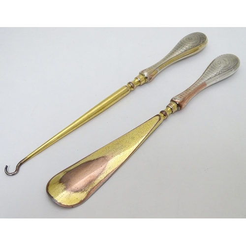 164 - Silver handled button hook and shoe horn with engine turned decoration and traces of gilding. Hallma... 