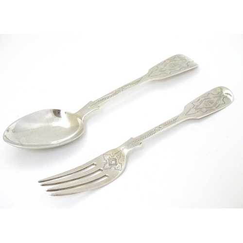 166 - A cased Victorian silver Christening set comprising fork and spoon with engraved decoration. Hallmar... 