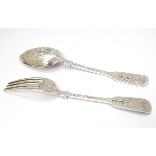 166 - A cased Victorian silver Christening set comprising fork and spoon with engraved decoration. Hallmar... 