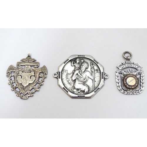 168 - Two silver fobs hallmarked Birmingham 1894 and Birmingham 1907. Together with a medallion depicting ... 