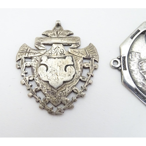 168 - Two silver fobs hallmarked Birmingham 1894 and Birmingham 1907. Together with a medallion depicting ... 