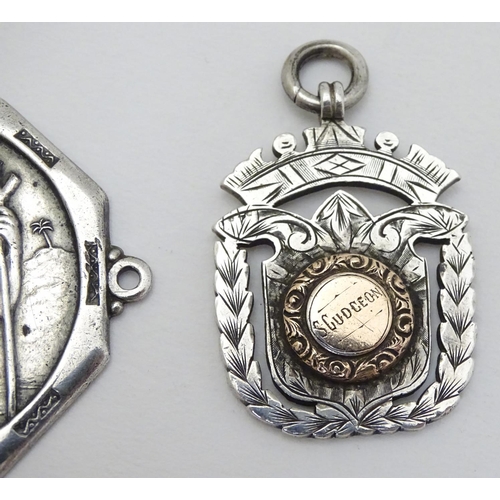 168 - Two silver fobs hallmarked Birmingham 1894 and Birmingham 1907. Together with a medallion depicting ... 