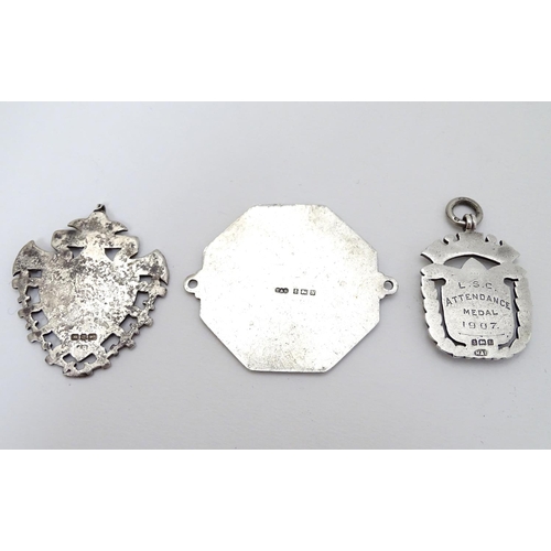 168 - Two silver fobs hallmarked Birmingham 1894 and Birmingham 1907. Together with a medallion depicting ... 