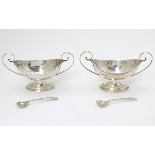 170 - A cased pair of silver pedestal table salts. Hallmarked Birmingham 1909 maker J Sherwood & Sons.  To... 