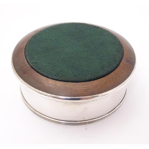 171 - A silver bottle coaster with turned wooden base. Hallmarked London 1991 maker J A Campbell. Approx 4... 