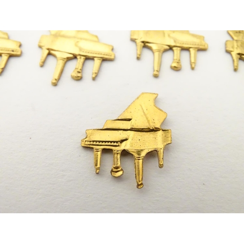 172 - A quantity of gilt metal jewellery findings of grand piano form. Approx 3/4'' wide