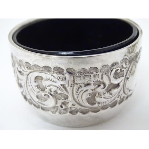 174 - A Victorian silver embossed pepper pot hallmarked 1888 maker E S Barnsley & Co 3 1/2'' high. Togethe... 