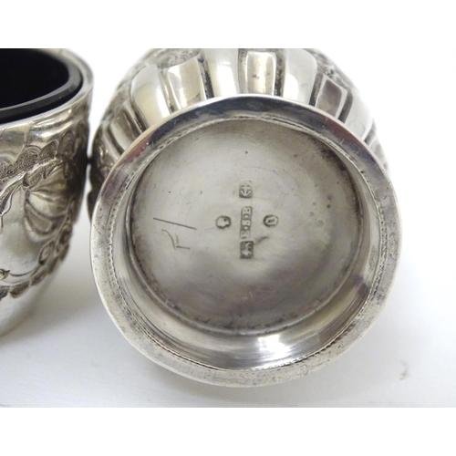 174 - A Victorian silver embossed pepper pot hallmarked 1888 maker E S Barnsley & Co 3 1/2'' high. Togethe... 