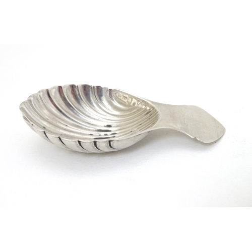 176 - A silver caddy spoon with shell formed bowl. Hallmarked Birmingham 1972 maker Turner & Simpson 3 1/4... 