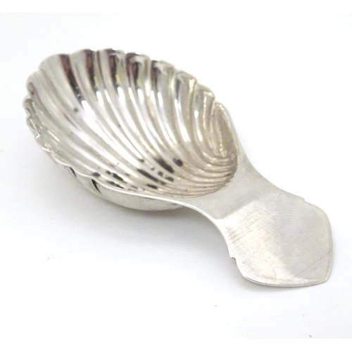 176 - A silver caddy spoon with shell formed bowl. Hallmarked Birmingham 1972 maker Turner & Simpson 3 1/4... 