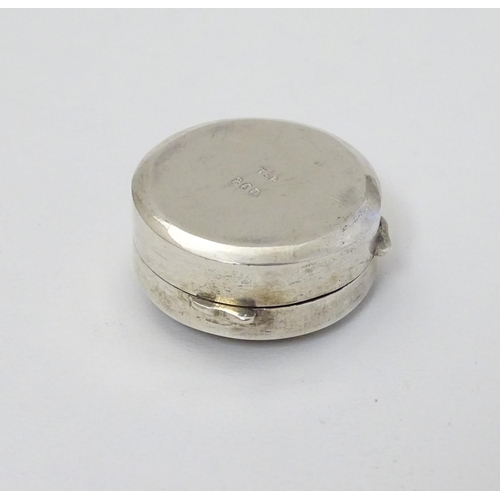 180 - A Continental white metal pill box of circular form 1 1/4'' diameter