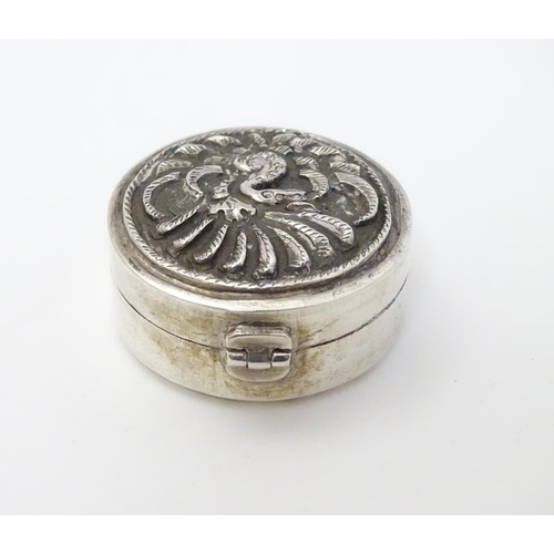 180 - A Continental white metal pill box of circular form 1 1/4'' diameter