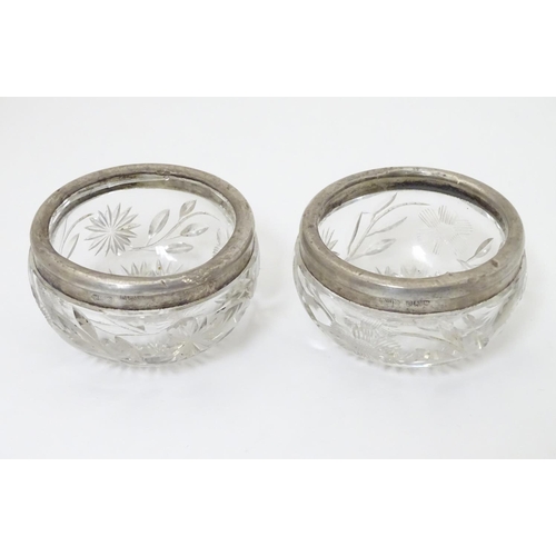 181 - A pair of cut glass salts with silver rims, hallmarked London 1913 maker William Henry Sparrow 2 1/2... 