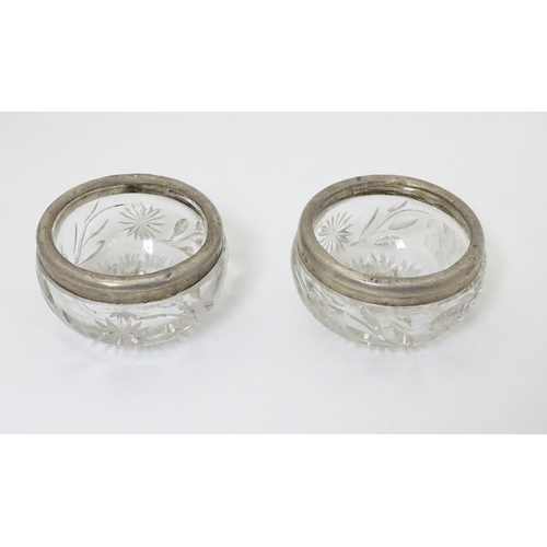 181 - A pair of cut glass salts with silver rims, hallmarked London 1913 maker William Henry Sparrow 2 1/2... 