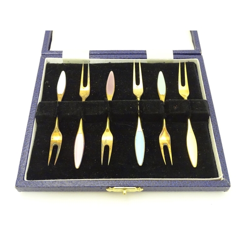 183 - A cased set of 6 Danish silver gilt pickle forks with guilloché enamel decoration to handles  Marked... 