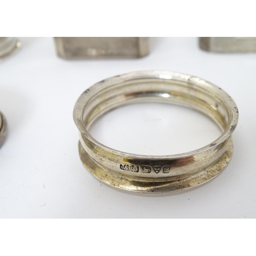 190 - 13 assorted silver napkin rings various dates and makers, some with engine turned deocration, togthe... 