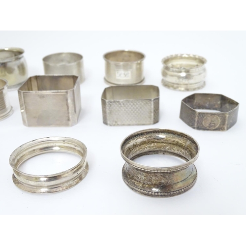 190 - 13 assorted silver napkin rings various dates and makers, some with engine turned deocration, togthe... 