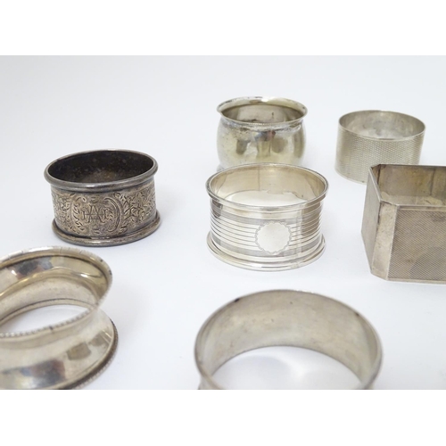 190 - 13 assorted silver napkin rings various dates and makers, some with engine turned deocration, togthe... 