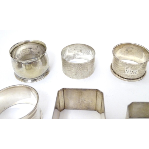 190 - 13 assorted silver napkin rings various dates and makers, some with engine turned deocration, togthe... 