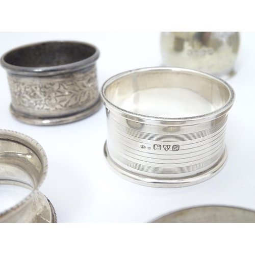 190 - 13 assorted silver napkin rings various dates and makers, some with engine turned deocration, togthe... 