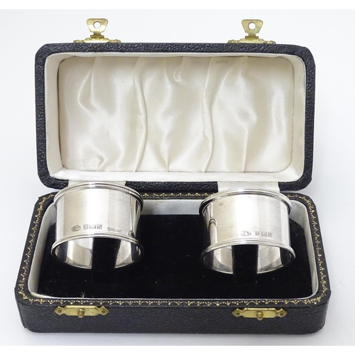 192 - A cased pair of silver napkin rings hallmarked Birmingham 1954/1956 maker Adie Bros Ltd.