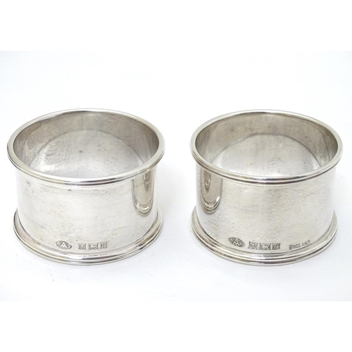 192 - A cased pair of silver napkin rings hallmarked Birmingham 1954/1956 maker Adie Bros Ltd.