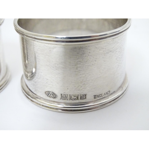 192 - A cased pair of silver napkin rings hallmarked Birmingham 1954/1956 maker Adie Bros Ltd.