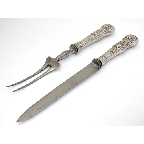 195 - Carving knife and fork with white metal Queens pattern handles. The knife 12 1/2'' long