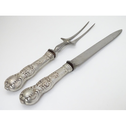 195 - Carving knife and fork with white metal Queens pattern handles. The knife 12 1/2'' long