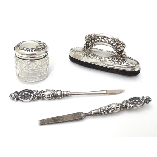 196 - Manicure items comprising silver handled tools, buffer and silver lidded pot. Hallmarked Birmingham ... 